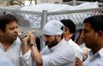 Saif carrying his father's body