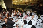 Demonstrators break open the gate as they storm the Kuwaiti National Assembly