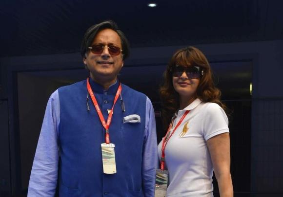 Sunanda poses with her husband at the Indian F1 Grand Prix in Greater Noida