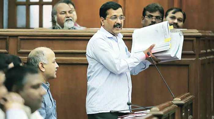 Kejriwal showing documents in Delhi Assembly